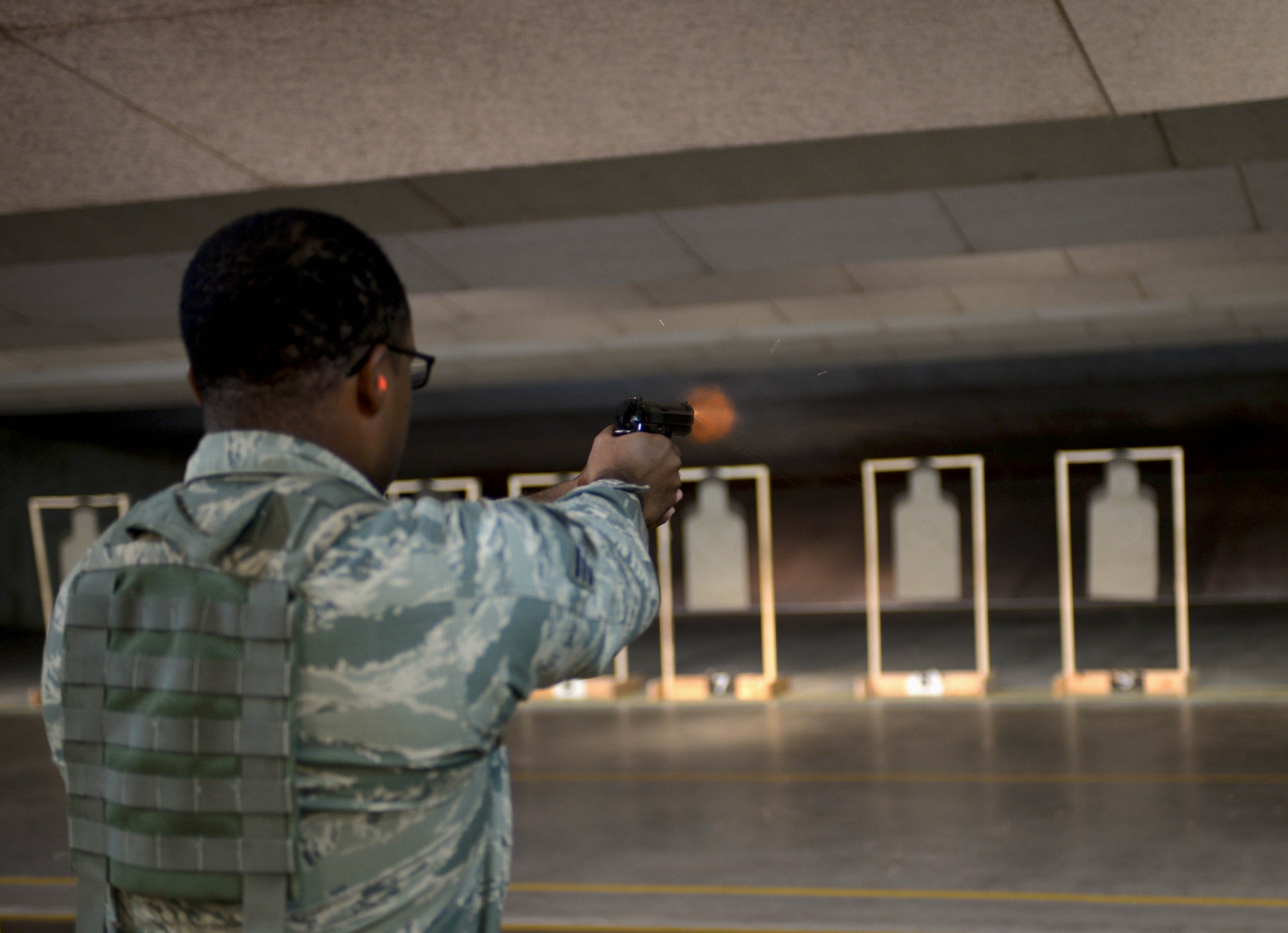 Senior Airman Tijon North, a response force leader assigned to the 28th Security Forces Squadron, fires an M9 pistol at the Combat Arms Training and Maintenance firing range at Ellsworth Air Force Base, S.D., Oct. 6, 2016. Ellsworth’s CATM has trained more than 2,000 Airmen this year with more than 500 sent downrange. (U.S. Air Force photo by Airman 1st Class Donald C. Knechtel)
