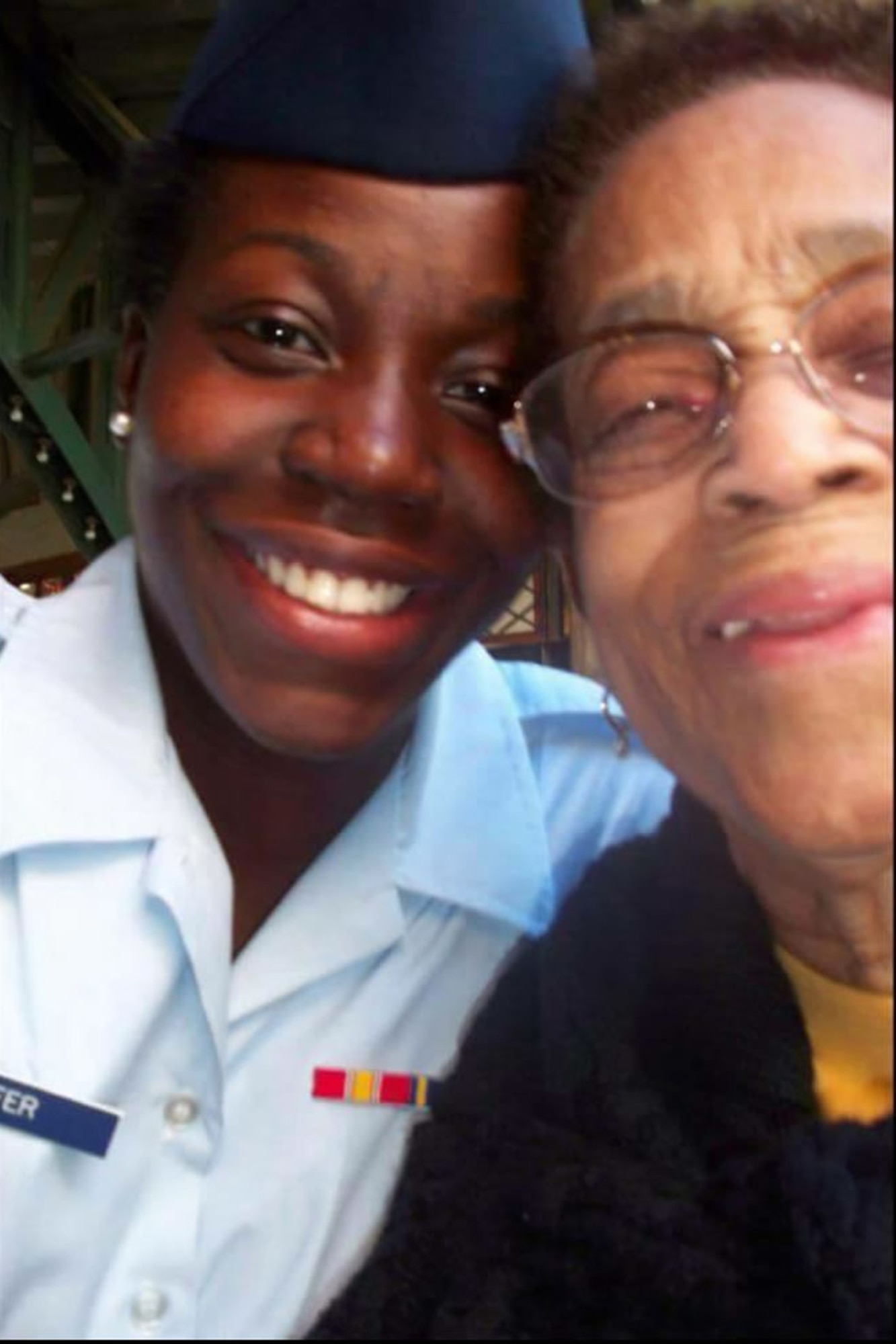 This is a photo of me and my grandmother after I graduated from basic training Oct. 14, 2011. Family is important to me as I reflect on the holidays. (U.S. Air Force photo/Senior Airman Jaeda Tookes)