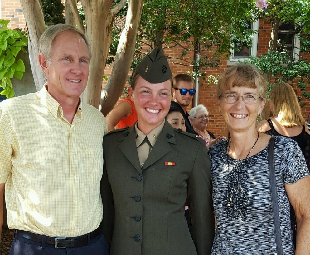 Second Lieutenant Carrie Yonge poses with her father, Larry Yonge, and her mother, Carrie Yonge, after being commissioned to second lieutenant, Aug. 6, 2016. Carrie Yonge’s grandfather, a former Naval aviator, pinned her rank on during the commissioning ceremony after graduating. Yonge is a plans officer with Plans and Research for Marine Corps Recruiting Command.