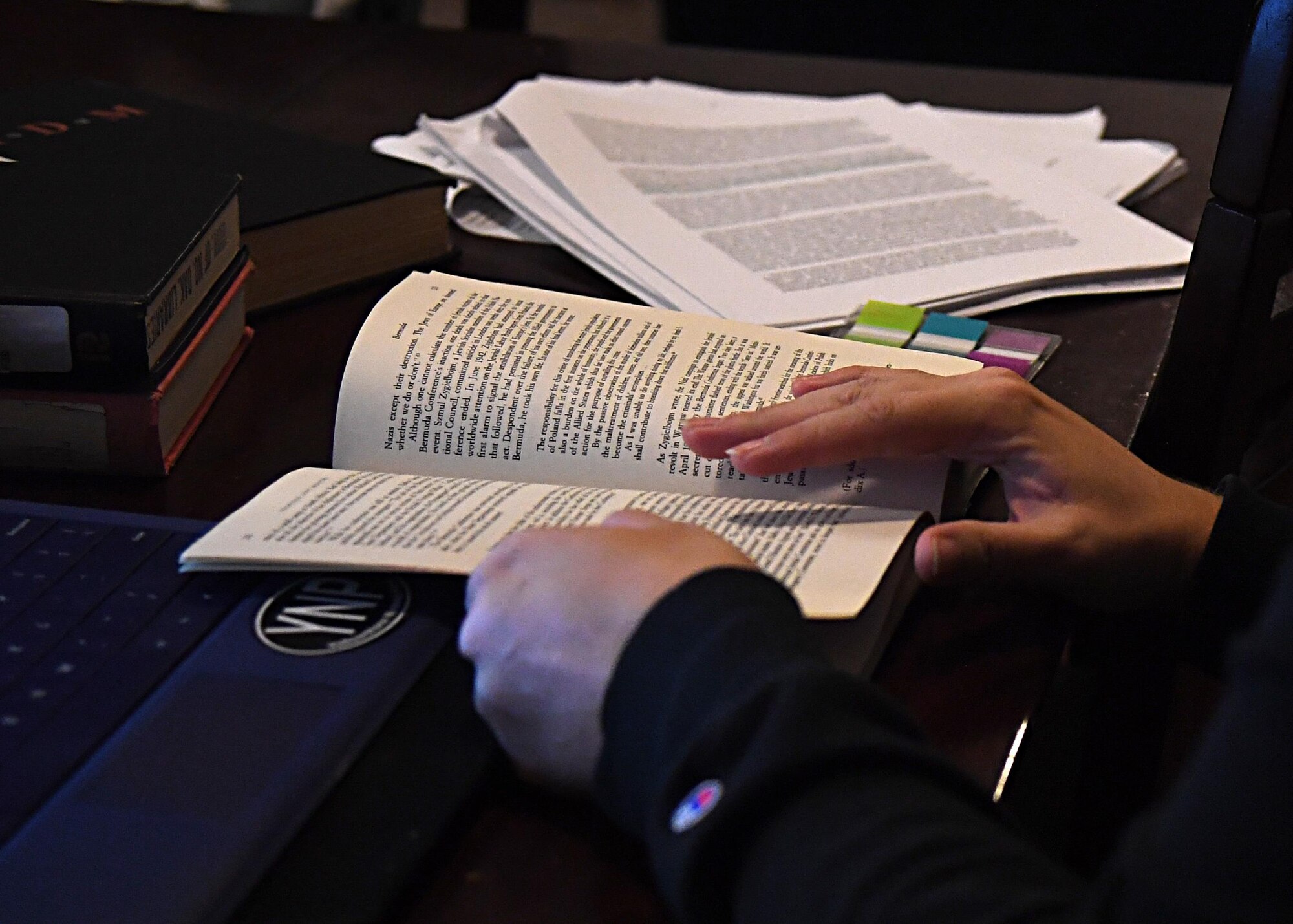 Kyla Willingham skims through a book Nov. 21, 2016, on Grand Forks Air Force Base, N.D. Kyla is a full-time student at the University of North Dakota and spends the rest of her time taking care of her two children and spending time as a family. (U.S. Air Force photo by Senior Airman Ryan Sparks)