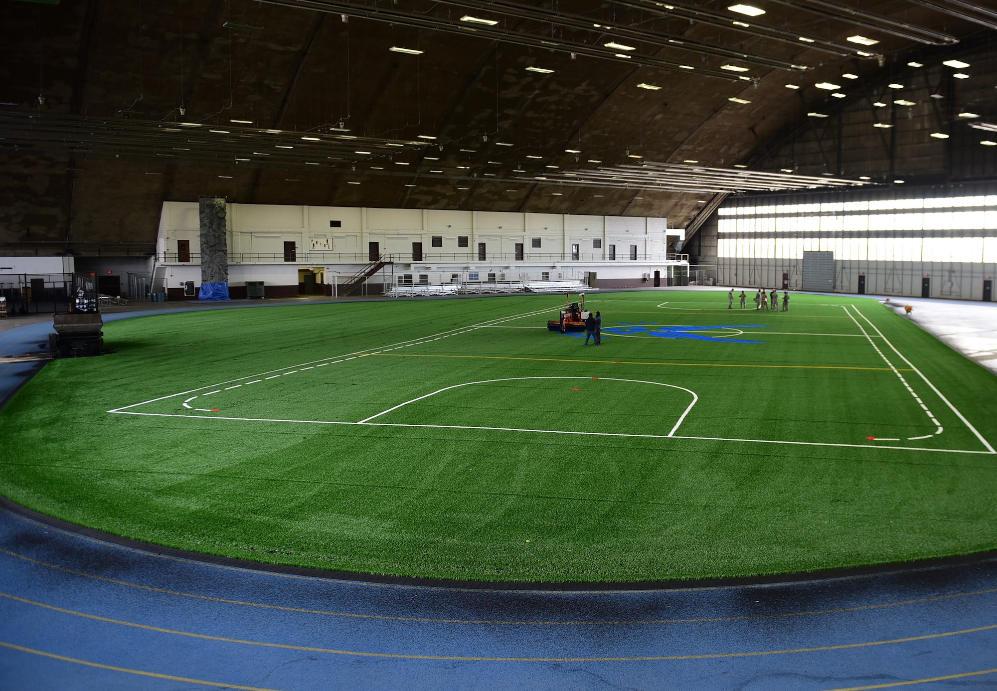 The Pride Hangar receives the final touches of its renovation at Ellsworth Air Force Base S.D., Nov. 21, 2016. The $249,000 project consisted of installation of a new Field Turf XT-65 sports field, increasing the area of the turf by 7,000 square feet, and two new batting cages. (U.S. Air Force photo by Airman 1st Class James L. Miller)