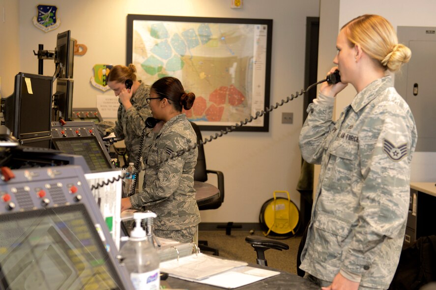 Airmen with the 5th Bomb Wing command post complete daily operations at Minot Air Force Base, N.D., Nov. 15, 2016. Command post is responsible for relaying critical information to wing leadership to wing leadership to help ensure both 91st Missile Wing and 5th BW respond properly at a moment's notice. (U.S. Air Force photo/Airman 1st Class Jessica Weissman)