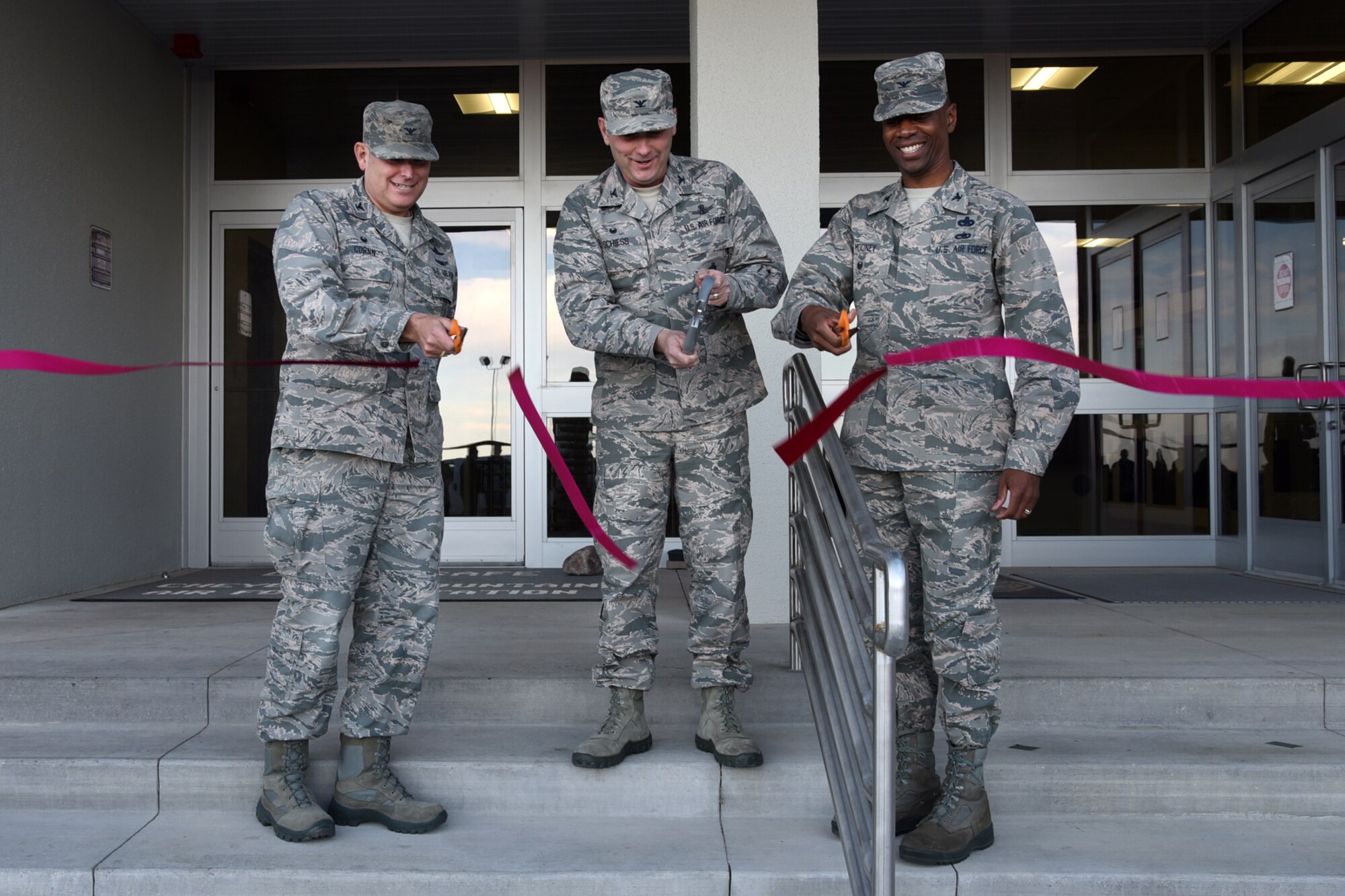 CHEYENNE MOUNTAIN AIR FORCE STATION, Colo. – Col. Doug Schiess, 21st Space Wing commander, along with Col. Gary Cornn, 721st Mission Support Group commander and Col. Nathan Mooney II, Air Force Space Command deputy director of logistics, engineering and force protection, cut a ceremonial ribbon for the completion of the Cheyenne Mountain Air Force Station North Portal renovation on Nov. 16, 2016. The North Portal was declared fully operational after a massive mudslide devastated the facilities 3 years prior. (U.S. Air Force photo by Airman 1st Class Dennis Hoffman)