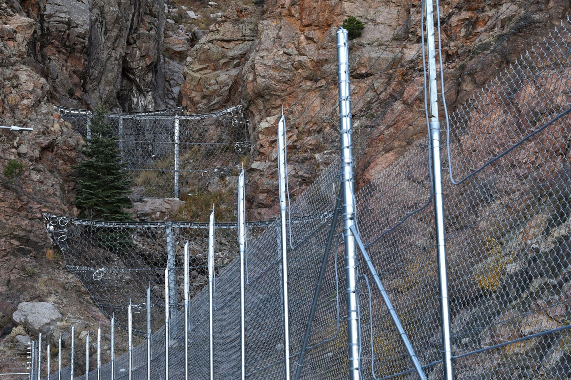 CHEYENNE MOUNTAIN AIR FORCE STATION, Colo. – Cheyenne Mountain Air Force Station completed repairs to the North Portal on Nov. 16, 2016. The North Portal project created eight rock nets that were designed to capture any future outfall of rocks and trees, thus protecting the facilities below. (U.S. Air Force photo by Airman 1st Class Dennis Hoffman)
