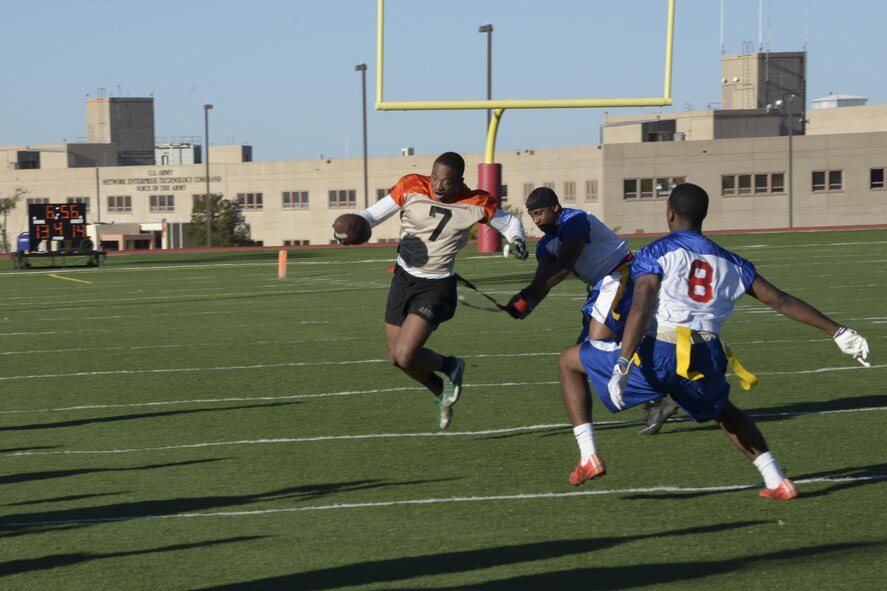 U.S. Air Force Master Sgt. Jerrime Williams, Davis-Monthan Air Force Base Mustangs linebacker, grabs the flag from a Fort Huachuca Black Knights offensive player during the 3rd annual Army vs. Air Force Turkey Bowl at Fort Huachuca, Ariz., Nov. 18, 2016.  The D-M Mustangs took home their third straight victory with a 14-13 win over the Black Knights. (U.S. Air Force photo by Senior Airman Betty R. Chevalier)