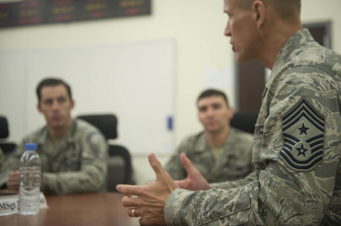 Chief Master Sgt. Steve McDonald, Air Combat Command command chief master sergeant, talks with enlisted Airmen deployed to Al Udeid Air Base, Qatar, during a mentoring session Nov. 21, 2016. (U.S. Air Force photo by Staff Sgt. Matthew B. Fredericks)
