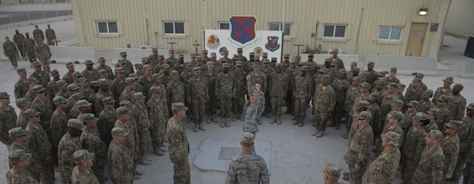 Gen. Hawk Carlisle, commander of Air Combat Command, leads 1st Expeditionary Civil Engineer Group Airmen in a chant after his visit Nov. 21, 2016 at Al Udeid Air Base, Qatar. Carlisle is visiting bases in the U.S. Central Command area of responsibility to engage with Airmen and thank them for their service. (U.S. Air Force photo by Staff Sgt. Matthew B. Fredericks)