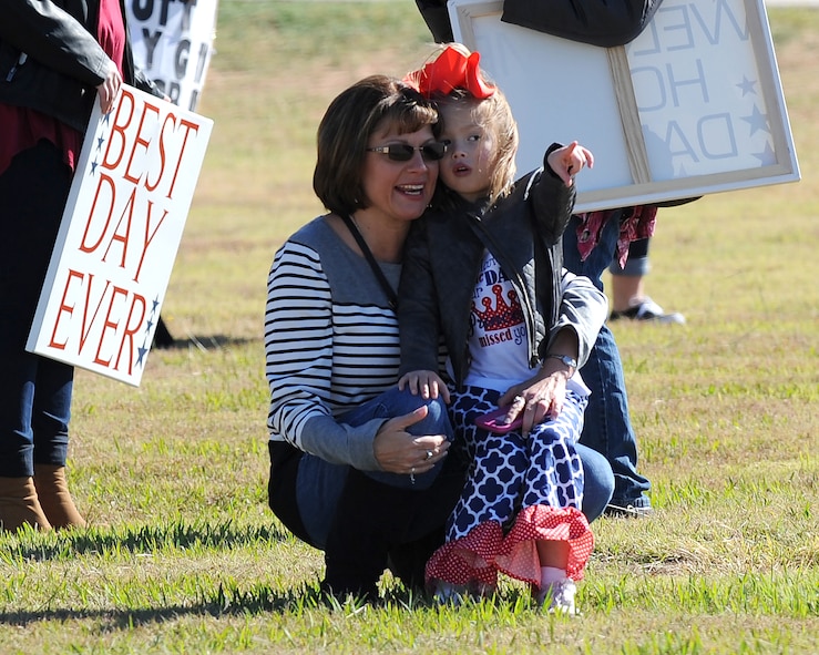 Autumn Finchum, left, and Adalee McGuire wait to see their loved one returning from a deployment at Dyess Air Force Base, Texas, Nov. 21, 2016. The aircrew deployed for four months and flew numerous missions over Europe to supplement U.S. European Command airlift assets and supported Horn of Africa operations by landing at small landing zones and conducting airdrops. (U.S. Air Force photo by Airman 1st Class Emily Copeland)