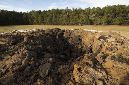 The pit of recently detonated Civil War-era cannonballs sits here. The 628th CES EOD flight worked with local emergency management teams to safely dispose of explosives brought ashore by the tides of Hurricane Matthew in October. 