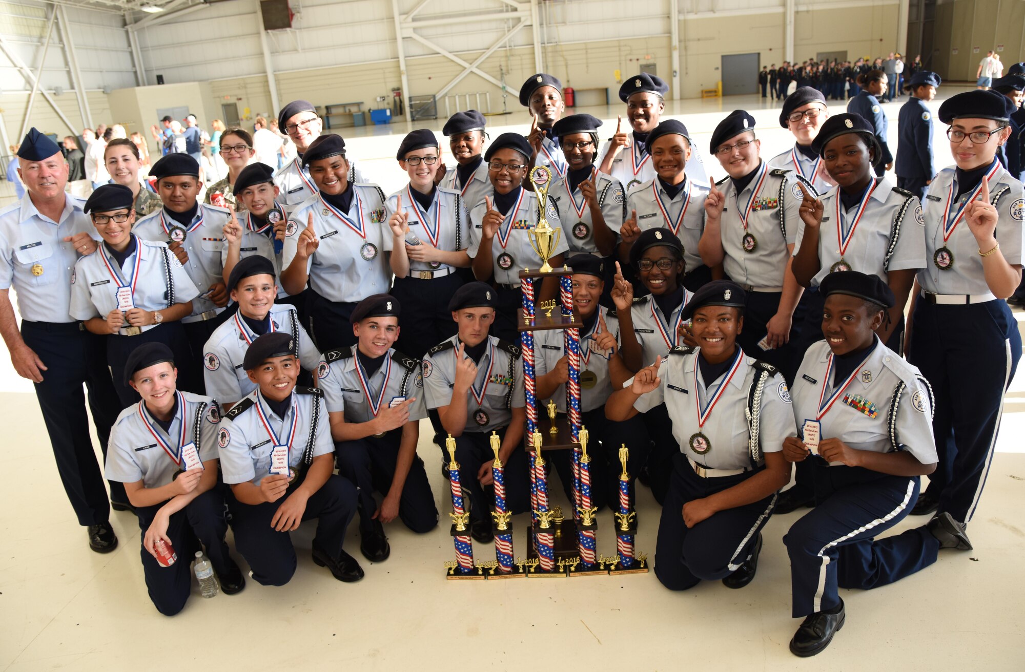 Biloxi High School Air Force Junior ROTC, Biloxi, Miss., members pose for a group photo with their trophies after earning top honors during the Third Annual Mississippi All-Services Junior ROTC Drill Competition Nov. 18, 2016, on Keesler Air Force Base, Miss. More than 500 Junior ROTC cadets, spectators and volunteers were in attendance where cadets battled for the best all-services Junior ROTC team in Mississippi. Seventeen Junior ROTC teams from all military branches were represented at the event with the Biloxi High School Air Force Junior ROTC earning the top honors. (U.S. Air Force photo by Kemberly Groue)