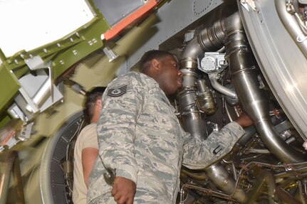 U.S. Air Force Tech. Sgt. Antonio Payton, 373rd Training Squadron Detachment 5 jet engine training instructor, teaches jet engine maintenance to an Airman Nov. 22, 2016, at Joint Base Charleston, South Carolina. 373rd TRS Det. 5 has 11 Maintenance Training Devices (MTDs) on site. MTDs are sections of the C-17 for the students to train in a safe and controlled setting while developing their technical skills. The hands-on training helps familiarize students with the aircraft and its key parts.