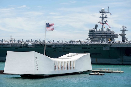 In this file photo, the aircraft carrier USS John C. Stennis (CVN 74) renders honors to the USS Arizona Memorial as the ship prepares to moor at Joint Naval Base Pearl Harbor-Hickam to participate in Rim of the Pacific 2016. Twenty-six nations, more than 40 ships and submarines, more than 200 aircraft and 25,000 personnel are participating in RIMPAC from June 30 to Aug. 4, in and around the Hawaiian Islands and Southern California. The world's largest international maritime exercise, RIMPAC provides a unique training opportunity that helps participants foster and sustain the cooperative relationships that are critical to ensuring the safety of sea lanes and security on the world's oceans. RIMPAC 2016 is the 25th exercise in the series that began in 1971. 