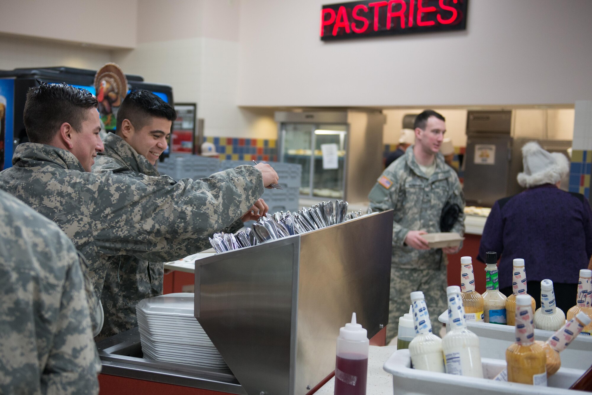 Soldiers, Airmen and civilians fill up the Wilderness Inn Dining Facility on Joint Base Elmendorf-Richardson, Alaska for a thanksgiving meal served by base leadership Nov 23. As a matter of tradition, every year, base leadership serve the Soldiers and Airmen of JBER a thanksgiving meal. 