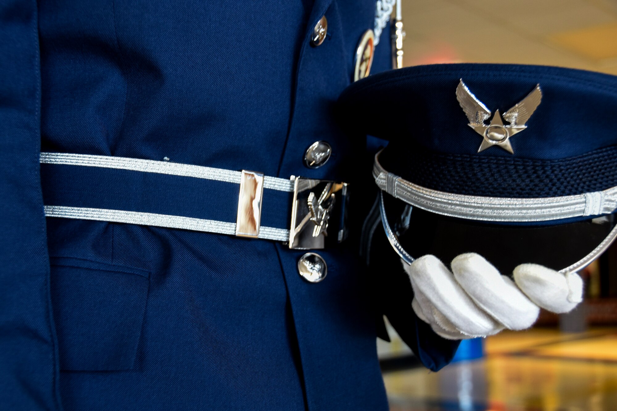 SIOUX FALLS, S.D. - A wheel cap, a blue with white border web belt, and white gloves is added to the Air Force service dress uniform as part of the 114th Fighter Wing color guard uniform. The 114th Fighter Wing color guard is organized through the Non-Commissioned Officer Academy Graduates Association where they strive to instill pride and esprit de’ corps through patriotism and community involvement. (U.S. Air Guard photo by Staff Sgt. Duane Duimstra/Released)
