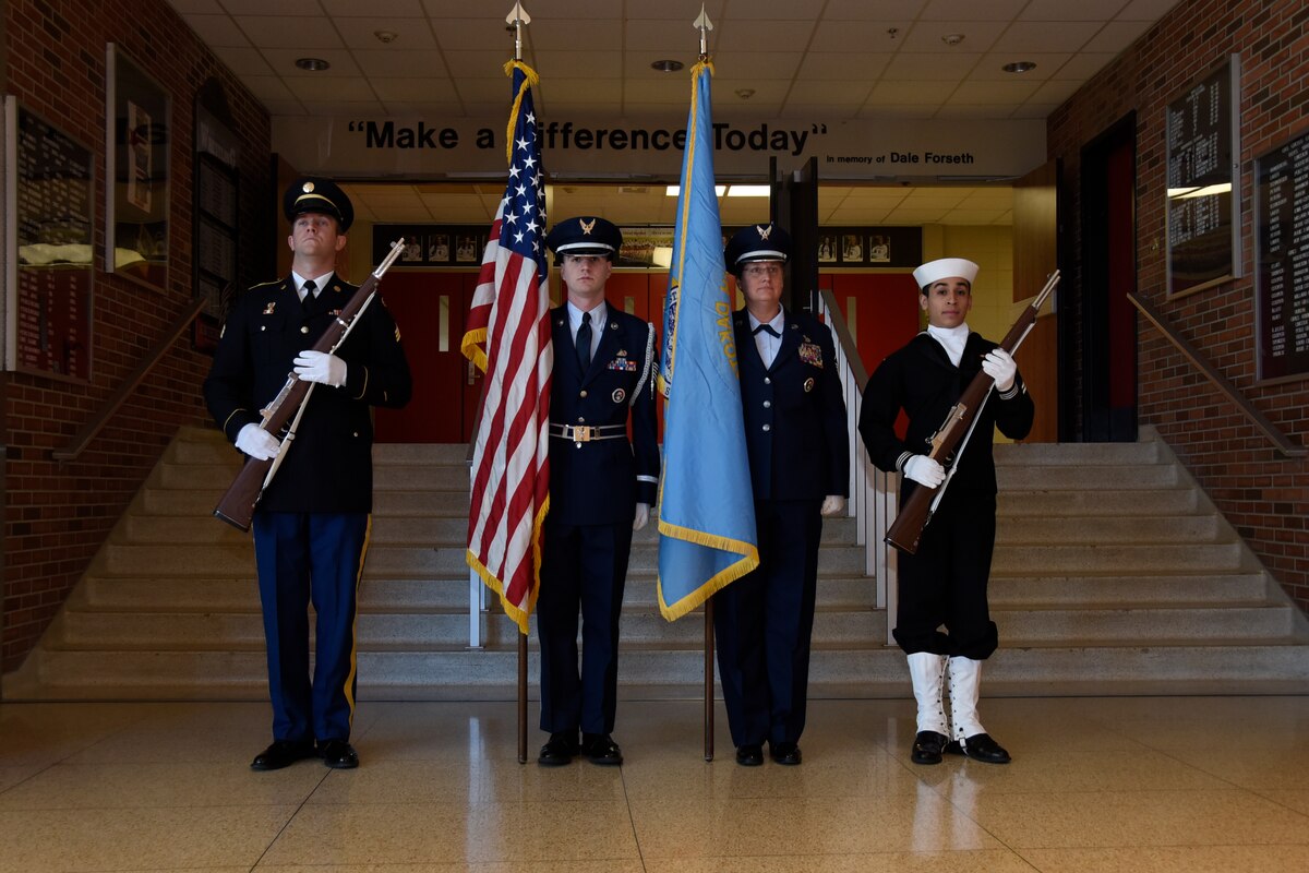 SIOUX FALLS, S.D. - A mixed service color guard prepares to post the colors during a Veteran's Day program at Lincoln High School, Sioux Falls, S.D., Nov. 11, 2016. The 114th Fighter Wing color guard is organized through the Non-Commissioned Officer Academy Graduates Association where they strive to instill pride and esprit de’ corps through patriotism and community involvement. (U.S. Air Guard photo by Staff Sgt. Duane Duimstra/Released)