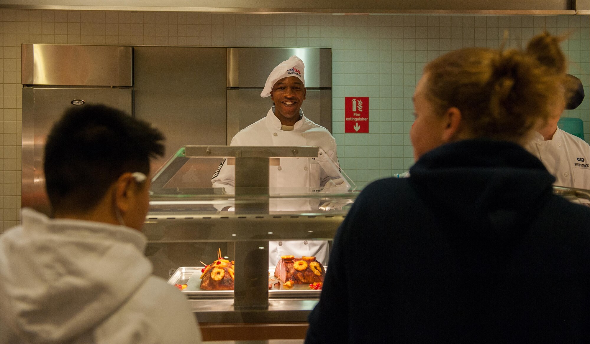 Chief Master Sgt. Kaleth Wright, U.S. Air Forces in Europe and Air Forces Africa command chief serves Airmen during a Thanksgiving meal at Ramstein Air Base, Germany, Nov. 24, 2016. The event was open to all DoD ID card holders, retirees and family members. Senior leaders serving meals on Thanksgiving to Airmen and their families is a longstanding tradition that allows them to spend time with servicemembers during the holiday. In the U.S., the modern Thanksgiving holiday tradition can trace its origins back to 1621 in the heart of a newly-founded city called Plymouth in present-day Massachusetts. However, the first nationwide Thanksgiving proclamation was made by the first president of the U.S., George Washington, in 1789. Since then, the holiday has been celebrated by an entire nation to recount the blessings of the year. (U.S. Air Force photo by Airman 1st Class Lane T. Plummer)