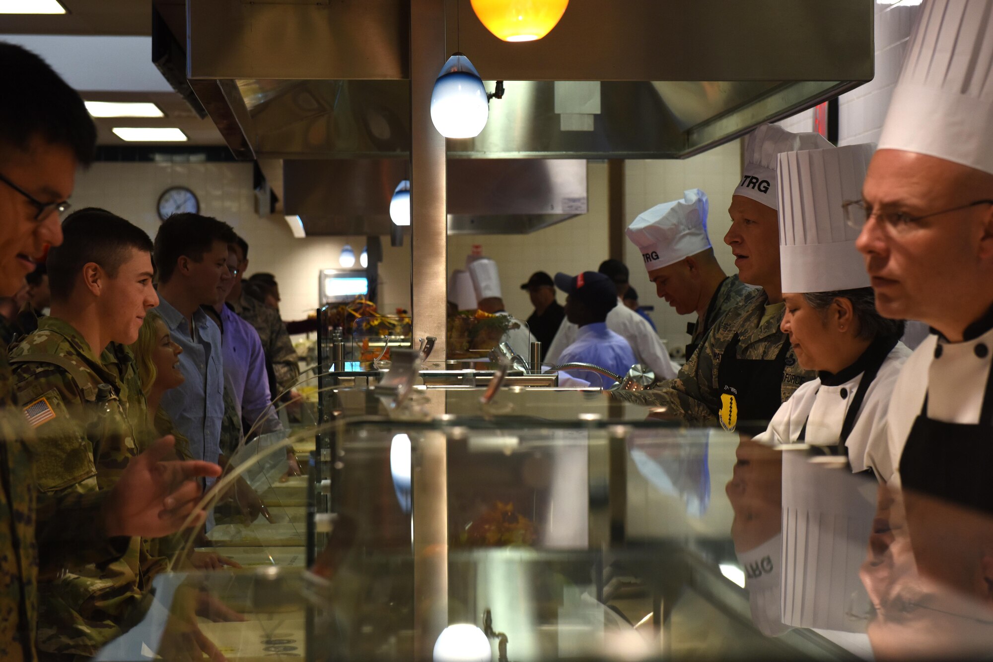 Base leadership serves service members for Thanksgiving at the Cressman Dining Facility on Goodfellow Air Force Base, Texas, Nov. 24, 2016. The leadership-served Thanksgiving meal is an annual tradition to boost morale for those who cannot spend the day with their families. (U.S. Air Force photo by Airman 1st Class Caelynn Ferguson/Released)