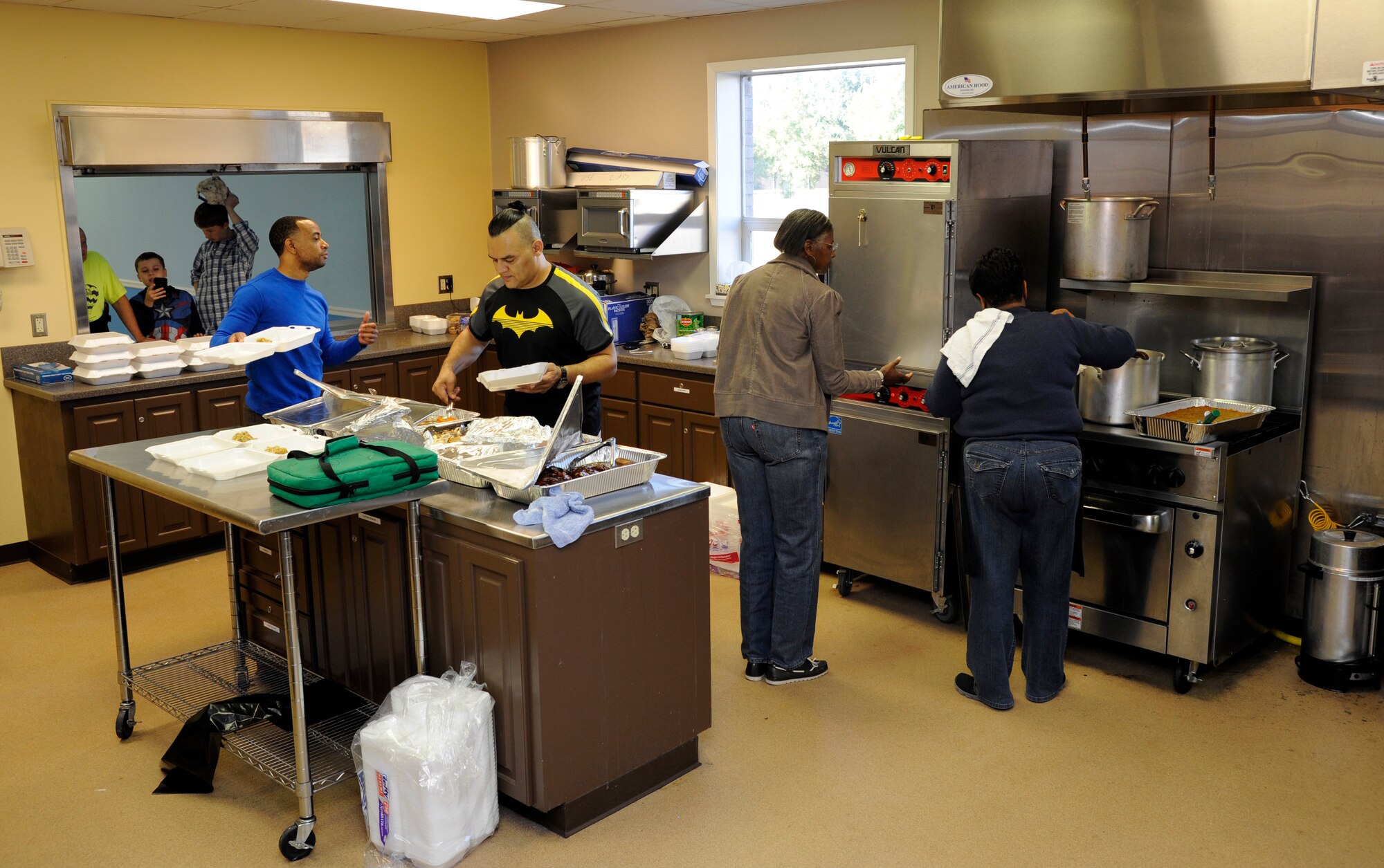 Barksdale Airmen Ministries volunteers prepare meals to be delivered to personnel working during Thanksgiving at the Chapel II annex, Barksdale Air Force Base, La., Nov. 24, 2016. In addition to serving those working during the holiday, BAM provided food for single Airmen and dorm residents. (U.S. Air Force photo/Staff Sgt. Joseph A. Pagán Jr.)