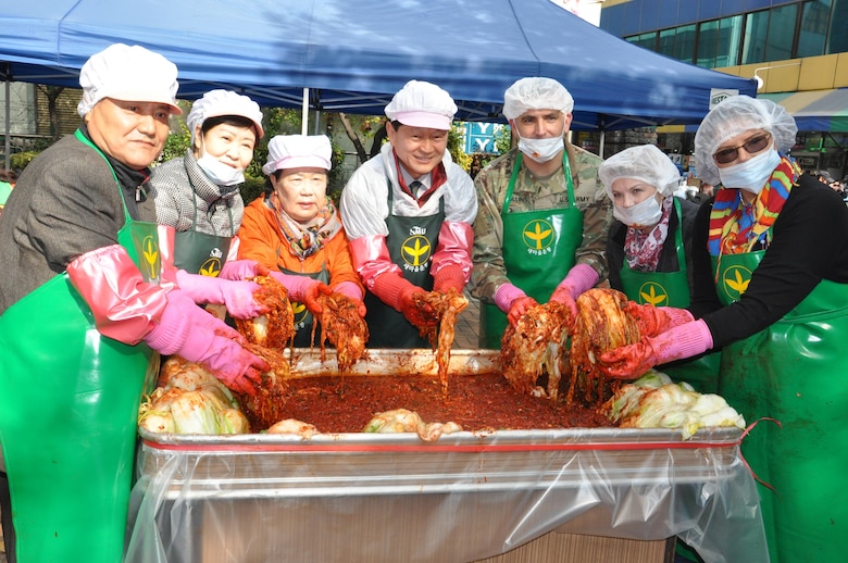 US Army Corps of Engineers Far East District Deputy Commander, Lt. Col. Richard Collins (third from right), Hope Bales, wife of FED Commander Col. Stephen Bales (far right) and volunteers from the Far East District joined members of the Seoul Jung-gu Saemaul Women’s Club to make kimchi for the area’s needy and elderly families Nov. 18.