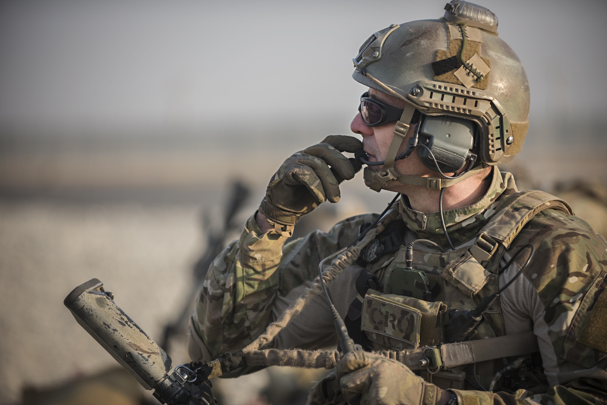 Maj. Bevan Hart, 83rd Expeditionary Rescue Squadron combat rescue officer, communicates with his team during a mass casualty exercise held Nov. 17, 2016 at Bagram Airfield, Afghanistan. The drill allowed pararescuemen, CROs and helicopter crews to rehearse their response to common scenarios encountered in theater. (U.S. Air Force photo by Staff Sgt. Katherine Spessa)