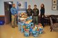 Senior Airman Raquel Densmore (pictured center right), 328th Airlift Squadron, delivers to the Niagara Falls Air Reserve Station 18 donated holiday baskets filled with everything needed for a Thanksgiving dinner November 21, 2016. Densmore's civilian employer, T.Y. Lin International, donated the baskets.  Also pictured are Joel Smith, 914 AW Airman and Family Readiness, Senior Airman Rochelle Densmore, 328 AS, and Holly Curcione, Friends of Family Support Association.  (U.S. Air Force photo by Master Sgt. Kevin Nichols)