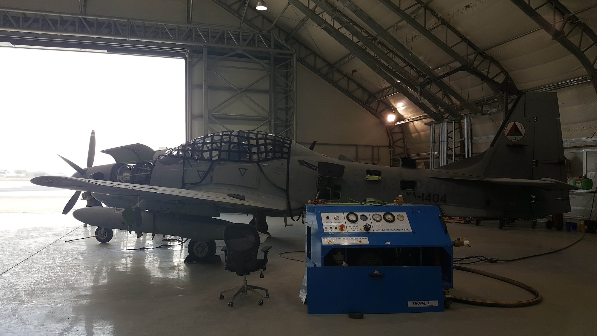 An A-29 Super Tucano sits inside a hangar at Hamid Karzai International Airport, Kabul, Afghanistan, November 19, 2016, while undergoing an inspection. Afghan Air Force maintainers have completed the first 600-hour aircraft inspection on the airframe in country. The inspection included an in-depth look at all parts of the plane to include flight controls, landing gear and avionics packages. (U.S. Air Force photo by Tech. Sgt. Jeffery Marino)