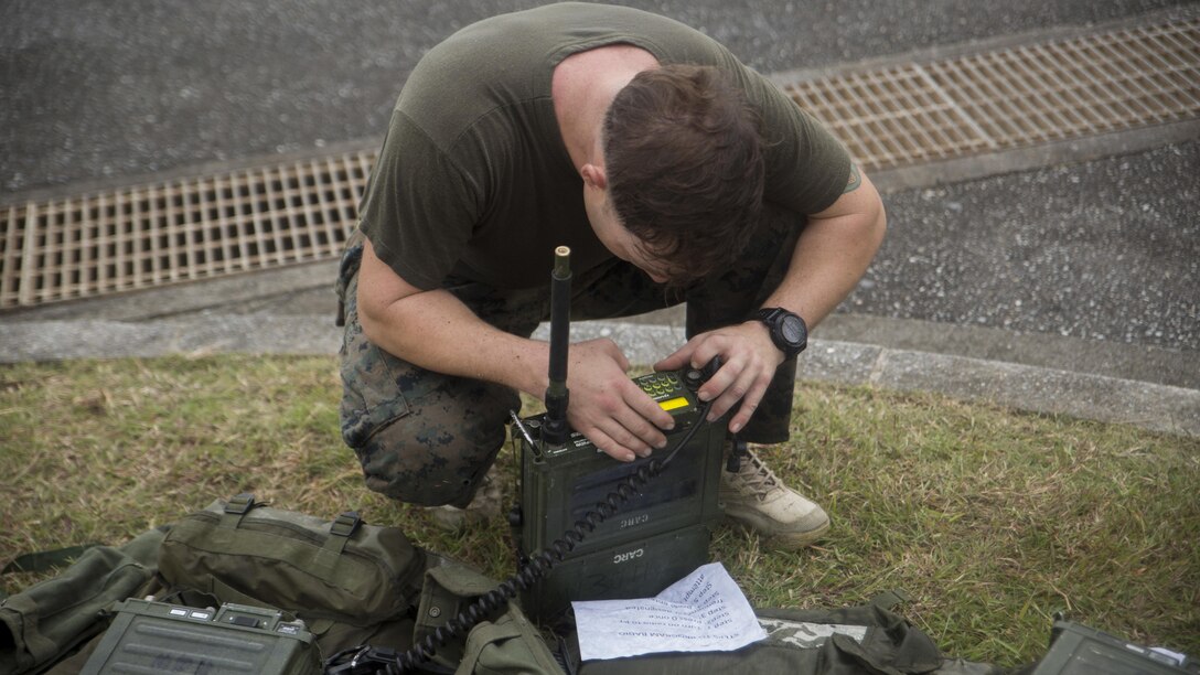 A Marine from 3d Reconnaissance Battalion, 3d Marine Division, III Marine Expeditionary Force, sets up a radio frequency for a communications check on Camp Schwab, Okinawa, Japan, Nov. 23, 2016, during their annual Warrior Challenge. The Warrior Challenge is an event which honors fallen Marines in the battalion and consists of nine stations to challenge the Marines mentally and physically. (U.S. Marine Corps photo by Lance Cpl. Andrew Neumann/Released)