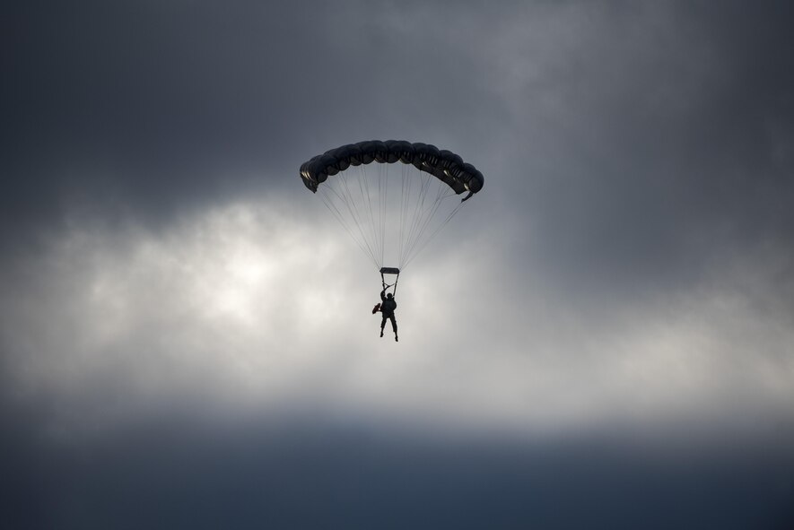 A U.S. Air Force Airman from the 320th Special Tactics Squadron parachutes through the sky after performing a long-range jump from a C-17 Globemaster III over the Pacific Ocean Nov. 22, 2016, off the western coast of Okinawa, Japan. Special Tactics team Airmen are organized, trained and equipped to conduct special operations core tasks during high-risk combat operations. (U.S. Air Force photo by Senior Airman Omari Bernard/Released)