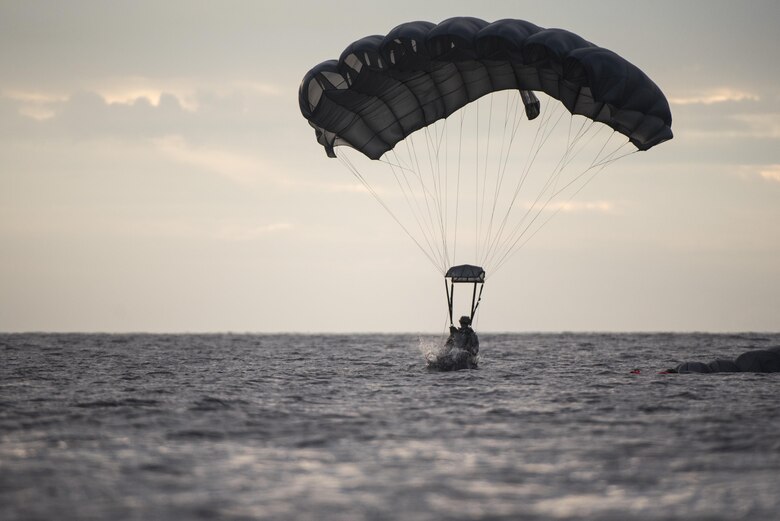 A U.S. Air Force Airman from the 320th Special Tactics Squadron lands in the water after performing a long-range jump from a C-17 Globemaster III into the Pacific Ocean Nov. 22, 2016. The 320th STS Airmen are trained to operate in harsh environments and under adverse conditions to complete their objectives. (U.S. Air Force photo by Senior Airman Omari Bernard/Released)