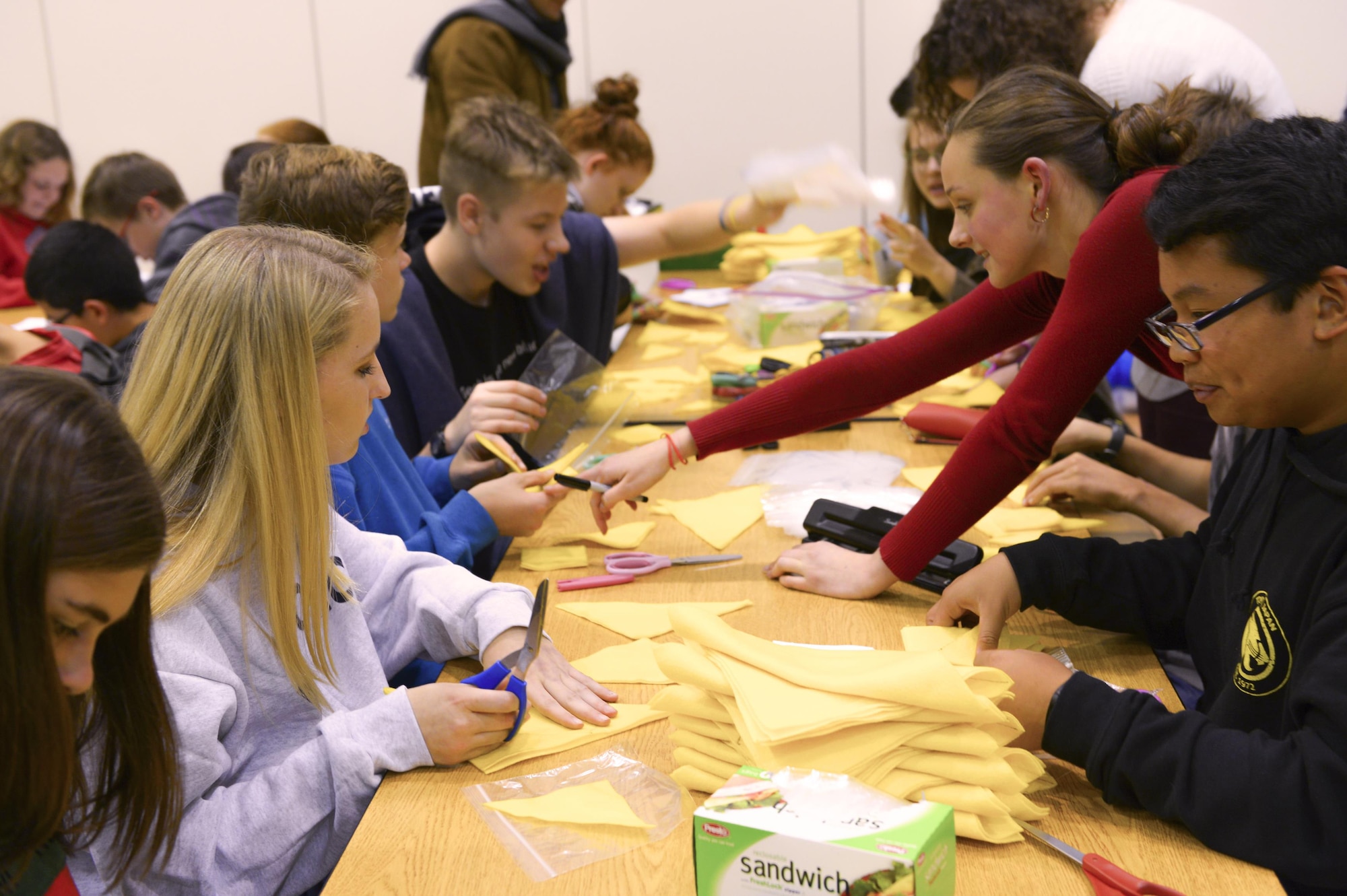 High school students craft Christmas gifts for children as part of Operation Christmas Child at Yokota Air Base, Japan, Nov. 2, 2016. Gifts sent through OCC travel to disadvantaged children throughout the world and are a popular way to give back during the holiday season. (U.S. Air Force photo by Airman 1st Class Elizabeth Baker/Released)
