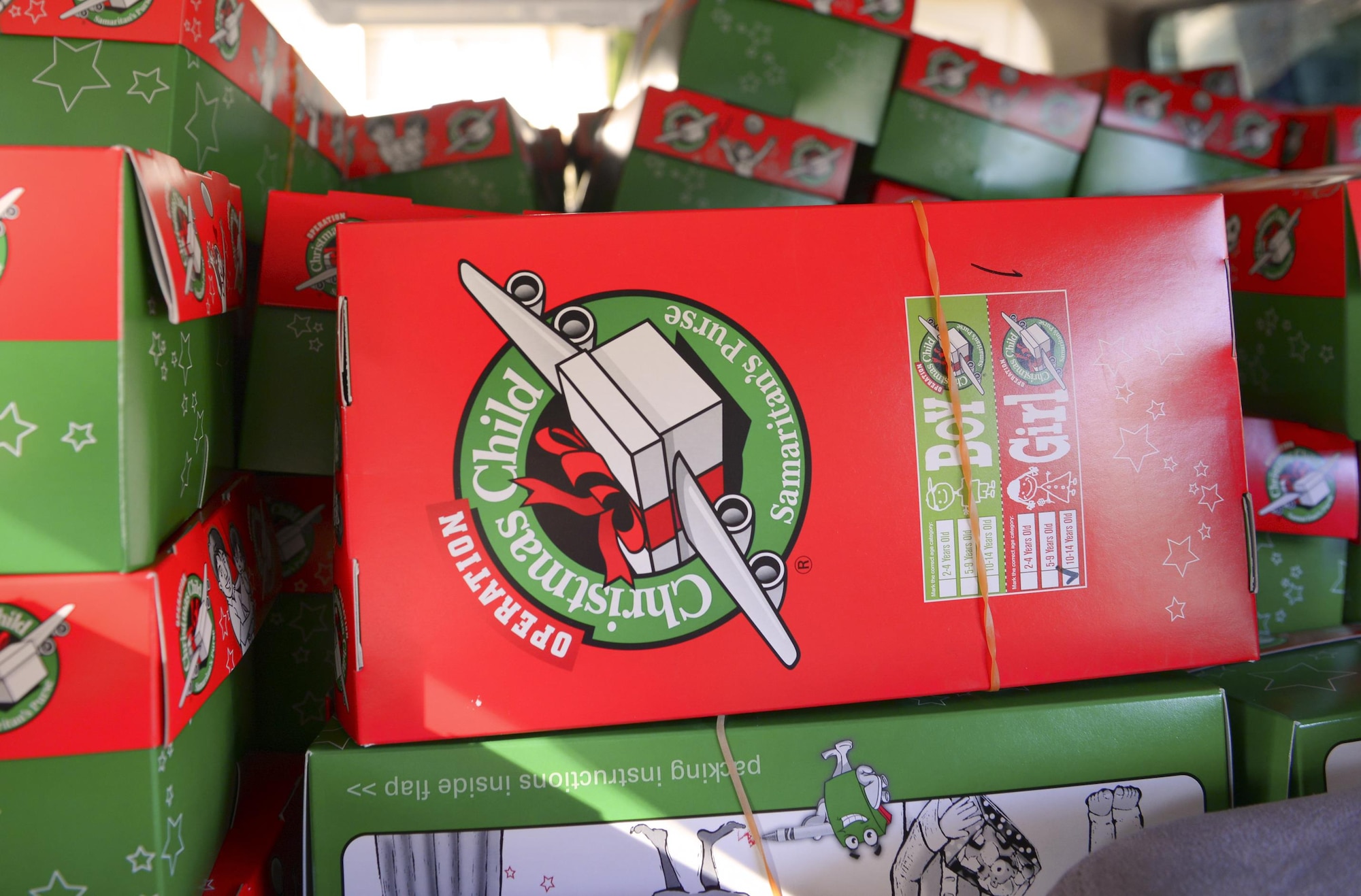 Gifts stacked in a van await delivery to children around the world at Yokota Air Base, Japan, Nov. 17, 2016. Since 1993, more than 100 million box gifts have been delivered to children in more than 130 countries through Operation Christmas Child. (U.S. Air Force photo by Airman 1st Class Elizabeth Baker/Released)