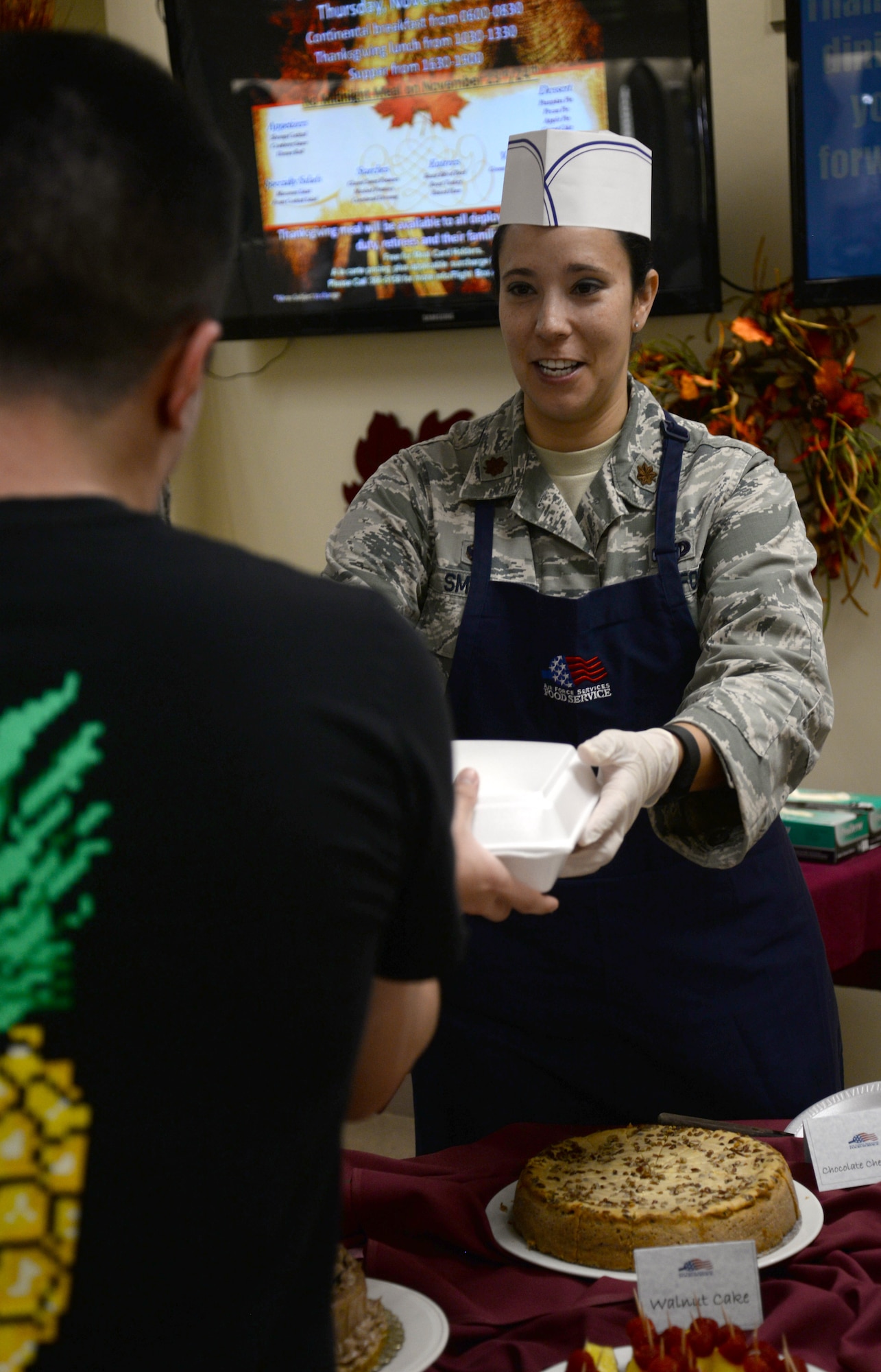 Maj. Katrina Smith, 36th Logistics Readiness Squadron commander, serves Thanksgiving meals at the Magellan Inn dining facility Nov. 24, 2016, at Andersen Air Force Base, Guam. The annual Thanksgiving meal brings service members together to eat and celebrate the holiday away from home with friends and family. (U.S. Air Force photo by Airman 1st Class Gerald R. Willis)