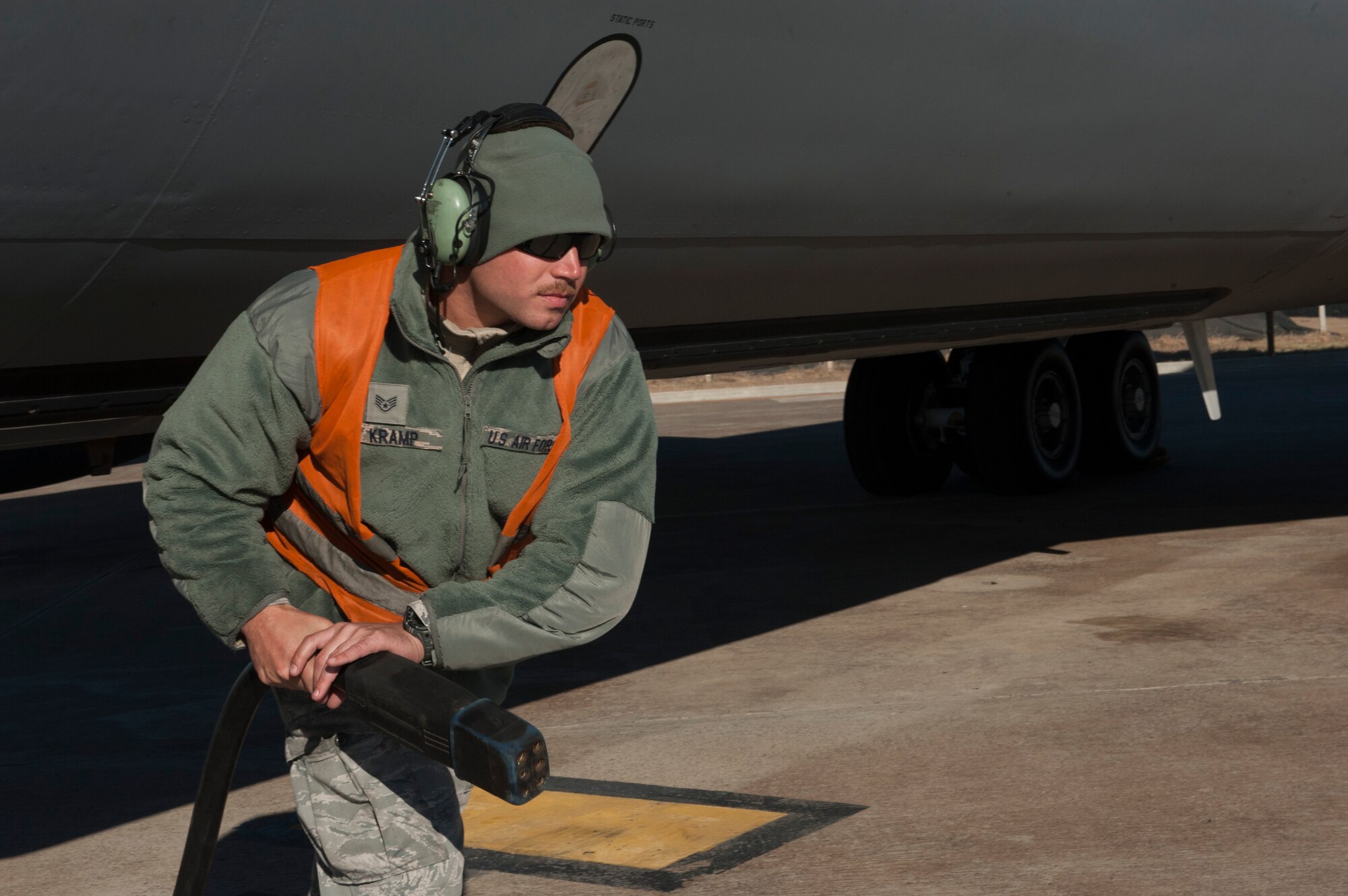 U.S. Air Force Staff Sgt. Brian, 447th Expeditionary Aircraft Maintenance Squadron crew chief, runs a power line from a KC-135 Stratotanker to aerospace ground support equipment (AGE) Nov. 2, 2016, at Incirlik Air Base, Turkey. Ground crews utilize AGE while performing preflight checks. (U.S. Air Force photo by Staff Sgt. Jack Sanders)