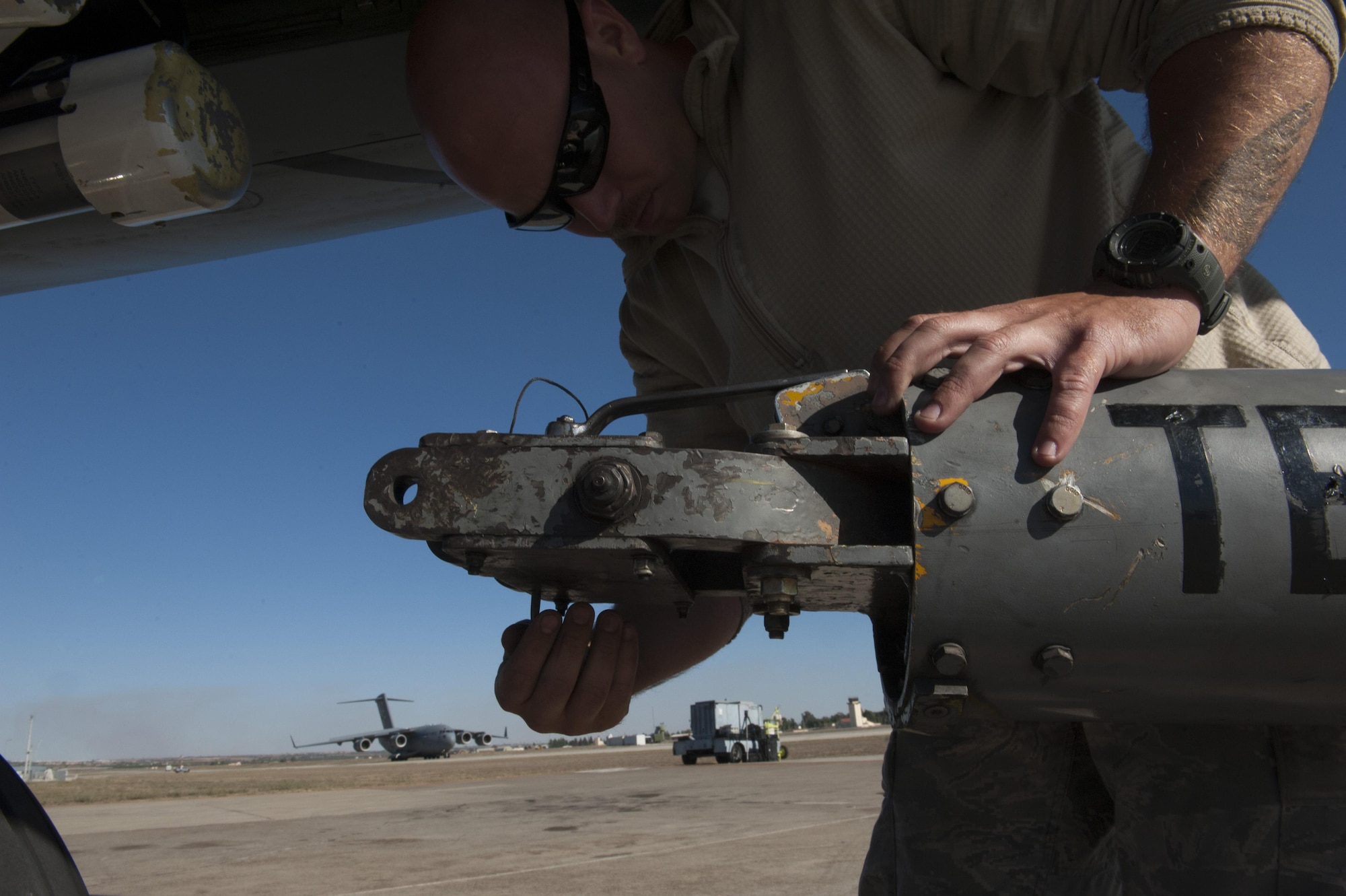 U.S. Air Force  Staff Sgt. Brian, 447th Expeditionary Aircraft Maintenance Squadron crew chief, unhooks a tow bar from the front of a KC-135 Stratotanker Nov. 11, 2016, at Incirlik Air Base, Turkey. The KC-135 Stratotanker has provided core U.S. Air Force aerial refueling capability for more than 50 years. (U.S. Air Force photo by Staff Sgt. Jack Sanders) 