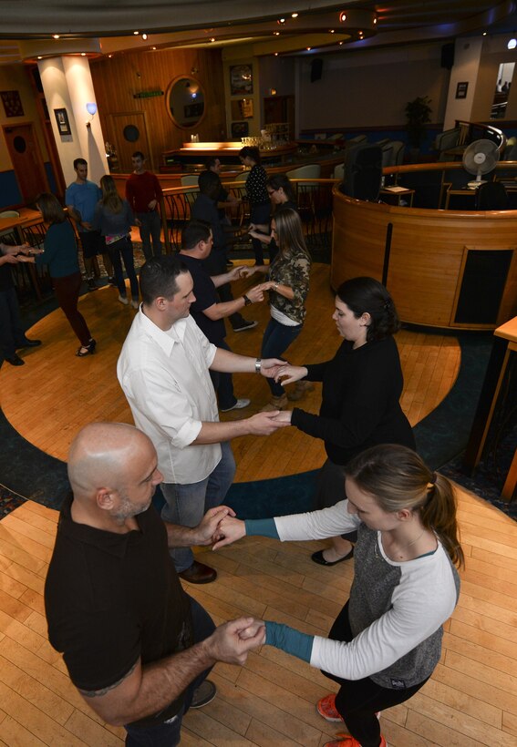 Participants from the Lively Latin Dance Class practice their moves Nov. 18, 2016, on RAF Mildenhall, England.  The event, hosted by the Center for Character and Culture, provided members of Team Mildenhall an alternate activity that promotes positive interpersonal communication and stress reduction.  (U.S. Air Force photo by Staff Sgt. Micaiah Anthony)