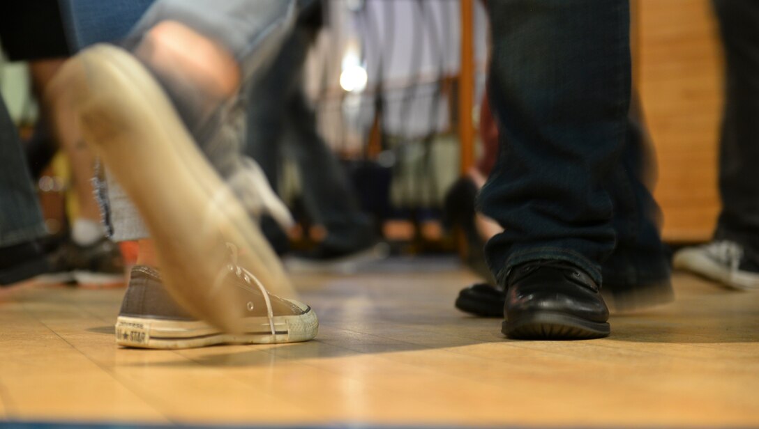 Participants from the Lively Latin Dance Class practice their footwork Nov. 18, 2016, on RAF Mildenhall, England. The next session is scheduled for Dec. 2. Future sessions for 2017 are scheduled to be held the first and third Fridays of each month. (U.S. Air Force photo by Staff Sgt. Micaiah Anthony)
