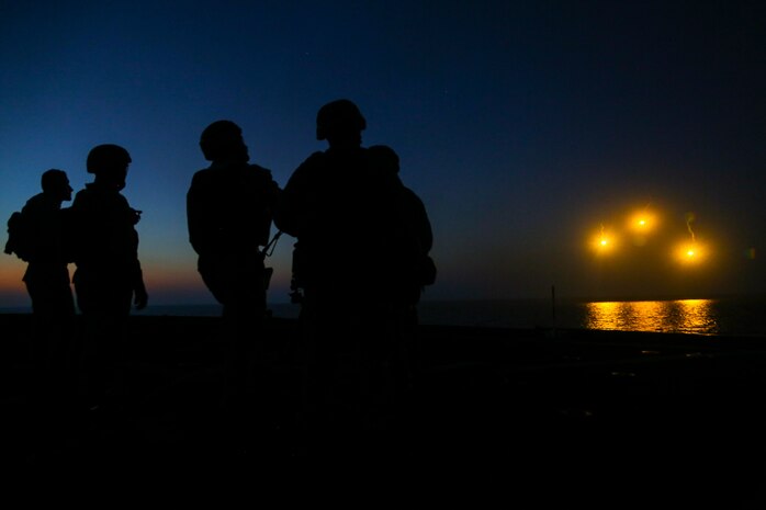 161121-M-PJ210-301 RED SEA (Nov. 21, 2016) Marines with Weapons Platoon, Charlie Company, Battalion Landing Team, 1st Battalion, 6th Marine Regiment, 22nd Marine Expeditionary Unit (MEU) shoot illumination rounds from an M224 60mm mortar system off the flight deck of the amphibious dock landing ship USS Whidbey Island (LSD 41) during a mortar range Nov. 21, 2016. 22nd MEU, deployed with the Wasp Amphibious Ready Group, is maintaining regional security in the U.S. 5th Fleet area of operations. (U.S. Marine Corps photo by Cpl. Chris Garcia)