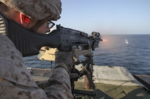 161120-M-LZ389-047 RED SEA (Nov. 20, 2016) A Marine with Battalion Landing Team, 1st Battalion, 6th Marine Regiment, 22nd Marine Expeditionary Unit (MEU) fires on a floating target during a live fire range aboard the amphibious dock landing ship USS Whidbey Island (LSD 41), Nov. 20, 2016. 22nd MEU, deployed with the Wasp Amphibious Ready Group, is maintaining regional security in the U.S. 5th Fleet area of operations. (U.S. Marine Corps photo by Gunnery Sgt. Neill A. Sevelius)