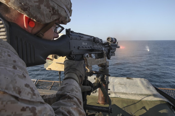 161120-M-LZ389-047 RED SEA (Nov. 20, 2016) A Marine with Battalion Landing Team, 1st Battalion, 6th Marine Regiment, 22nd Marine Expeditionary Unit (MEU) fires on a floating target during a live fire range aboard the amphibious dock landing ship USS Whidbey Island (LSD 41), Nov. 20, 2016. 22nd MEU, deployed with the Wasp Amphibious Ready Group, is maintaining regional security in the U.S. 5th Fleet area of operations. (U.S. Marine Corps photo by Gunnery Sgt. Neill A. Sevelius)