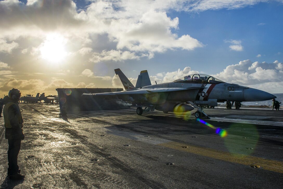 A Navy F/A-18F Super Hornet prepares to launch from the aircraft carrier USS Carl Vinson flight deck in the Pacific Ocean, Nov. 21, 2016. The aircraft and pilots are assigned to Strike Fighter Squadron 2. The Carl Vinson Strike Group recently completed a composite training unit exercise in preparation for an upcoming deployment. Navy photo by Petty Officer 3rd Class Sean M. Castellano