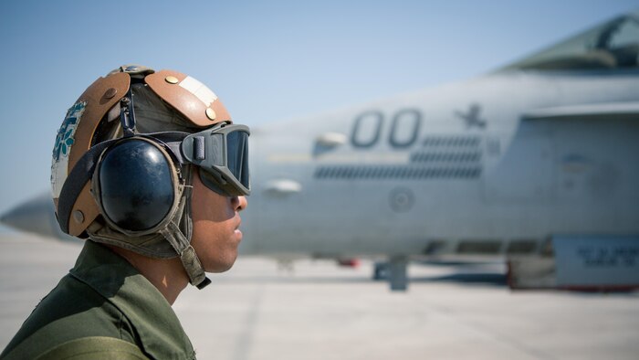 U.S. Marine Corps Lance Cpl. Sam Aulai, a powerliner with Marine All-Weather Fighter Attack Squadron 533, Special Purpose Marine Air-Ground Task Force - Crisis Response - Central Command 16.2, directs an F/A-18D prior to takeoff at an undisclosed location in Southwest Asia, Oct. 15, 2016. VMFA(AW)-533 departed the CENTCOM area of responsibility, completing deployment as part of the Aviation Combat Element of SPMAGTF-CR-CC.  The squadron conducted strikes in support of Operation Inherent Resolve, the operation to eliminate the ISIL terrorist group and the threat they pose to Iraq, Syria, and the wider international community. (U.S. Marine Corps photo by Sgt. Donald Holbert)