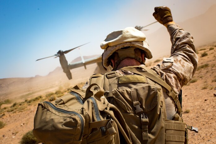 U.S. Marine Corps 1st Lt. Marc Kessler, a platoon commander with Fox Company, 2nd Battalion, 7th Marine Regiment, Special Purpose Marine Air-Ground Task Force - Crisis Response - Central Command, signals his platoon after conducting a live-fire raid training event during Mission Rehearsal Exercise in southern Jordan, Sept. 12, 2016. The MRX is a collective training event where the MAGTF elements collaborate to refine individual and cooperative capabilities. SPMAGTF - CR – CC is a self-sustaining expeditionary unit, designed to provide a broad range of crisis response capabilities throughout the Central Command area of responsibility, using organic aviation, logistical, and ground combat assets, to include embassy reinforcement and tactical recovery of aircraft and personnel. (U.S. Marine Corps photo by Cpl. Trever Statz/Released)