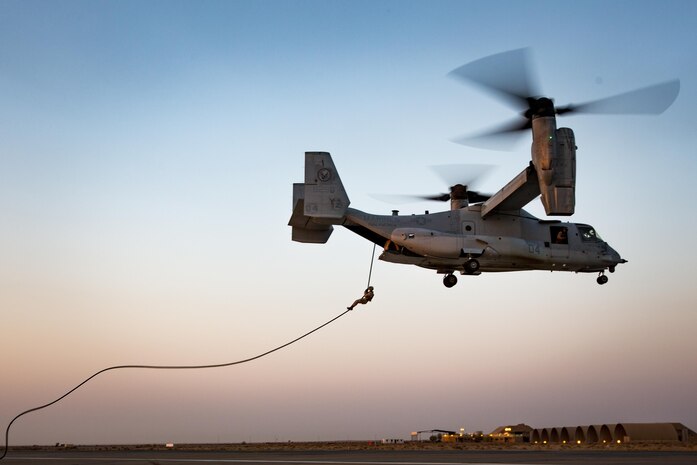 U.S. Marines with Fox Company, 2nd Battalion, 7th Marine Regiment, Special Purpose Marine Air Ground Task Force - Crisis Response - Central Command, rappel from an MV-22B Osprey during fast rope training while forward deployed, Sept. 17, 2016. Fast roping enables the quick insert of Marines into hostile landing zones limiting aircraft and personnel vulnerability. SPMAGTF-CR-CC is a self-sustaining expeditionary unit, designed to provide a broad range of crisis response capabilities throughout the Central Command area of responsibility, using organic aviation, logistical and ground combat assets, to include embassy reinforcement  and tactical recovery of aircraft and personnel. (U.S. Marine Corps photo by Cpl. Trever Statz/Released)