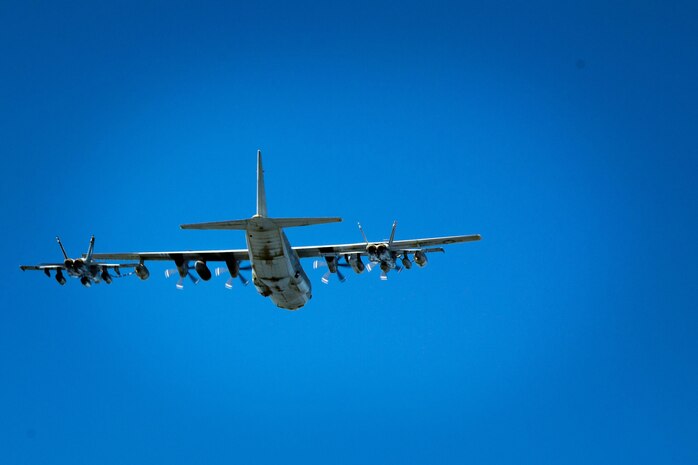 A KC-130J with Marine Aerial Refueler Transport Squadron 352, refuels two F/A-18D Hornets from Marine All-Weather Fighter Attack Squadron 533 during a Special Purpose Marine Air-Ground Task Force - Crisis Response - Central Command aerial refueling exercise, Oct. 13, 2016. SPMAGTF-CR-CC is a self-sustaining expeditionary unit, designed to provide a broad range of crisis response capabilities throughout the Central Command area of responsibility, using organic aviation, logistical, and ground combat assets, to include TRAP and embassy reinforcement. (U.S. Marine Corps photo by Cpl. Trever Statz)