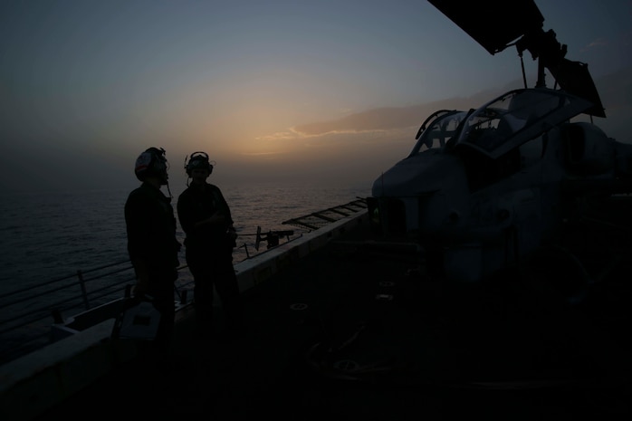 U.S. Marines with 22nd Marine Expeditionary Unit (MEU) prepare an AH-1W Super Cobra for flight aboard the amphibious transport dock ship USS San Antonio (LPD 17) in support of Operation Odyssey Lightning (OOL), Nov. 8, 2016. OOL is an ongoing operation at the request of the Libyan Government of National Accord (GNA), the United States military conducted precision air strikes against Daesh targets in Sirte, Libya, to support GNA-affiliated forces seeking to defeat Daesh in its primary stronghold in Libya. (U.S. Marine Corps photo by Sgt. Ryan Young)