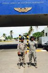 U.S. Air Force Staff Sgt. Angel Moquete, assigned to the 571st Mobility Support Advisory Squadron based at Travis Air Force Base, Calif., right, poses for a photo with a host-nation security force member in the Dominican Republic, Nov. 15, 2016. Air Force photo by Staff Sgt. Robert Hicks
