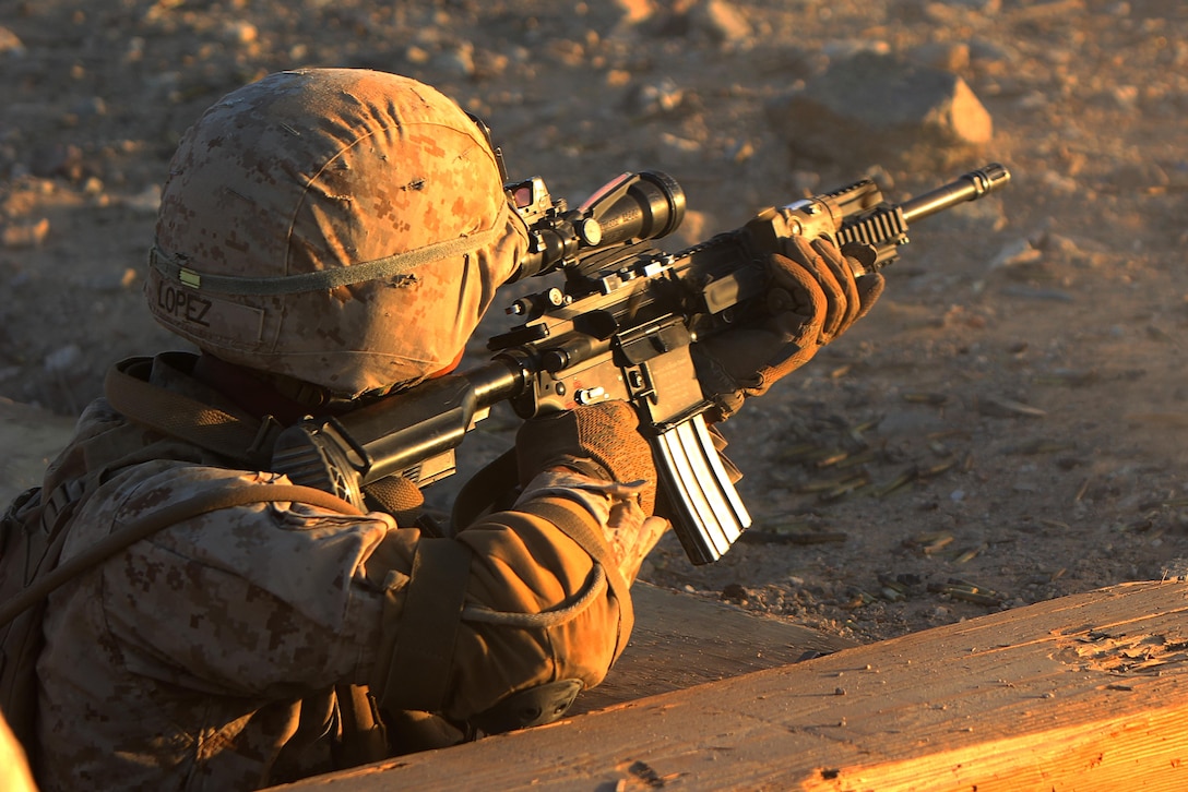 Lance Cpl. William Lopez fires his M27 Infantry Automatic Rifle at a simulated target at range 410A Marine Air-Ground Combat Center Twenty-nine Palms, Calif., Oct. 21, 2016. Marines with 1st Battalion, 2nd Marine Regiment, 2nd marine Division are preparing to support a Special Purpose Marine Air-Ground Task Force for their upcoming deployment. (U.S Marine Corps photo by Lance Cpl. Juan A. Soto-Delgado)