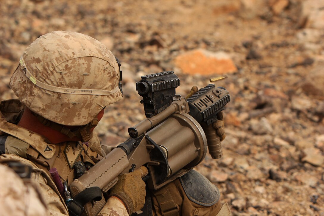 Lance Cpl. Anderson Elswick fires his M32A1 40mm Multi-Shot Grenade Launcher at a simulated enemy target at Range 400 at Marine Air-Ground Combat Center Twenty-nine Palms, Calif., Oct. 21, 2016. The M32A1 is capable of firing 40mm grenades at ranges up to approximately 400 yards. Elswick is a grenadier with 1st Battalion, 2nd Marine Regiment, 2nd Marine Division. (U.S Marine Corps photo by Lance Cpl. Juan A. Soto-Delgado)