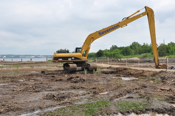 Heavy equipment near the banks of the Raritan River in Sayreville, NJ, removes contaminated soil from marsh land 30 miles southwest of Manhattan. The six-acre Superfund site, being remediated by the U.S. Army Corps of Engineers, New York District, is expected to be free of contaminants in 2017. (Photo: James D’Ambrosio, Public Affairs Specialist, U.S. Army Corps of Engineers, NY District.)