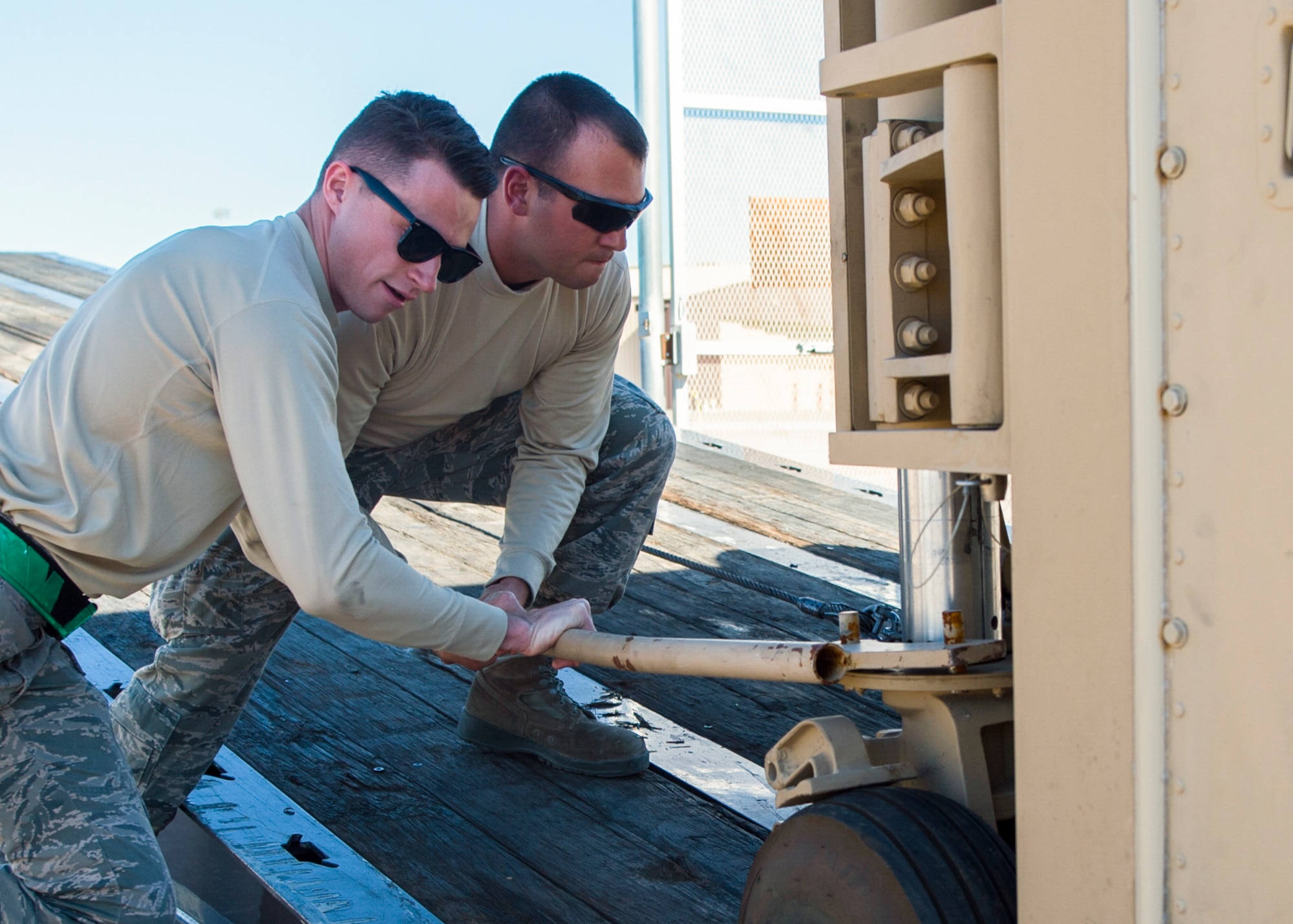 Senior Airman Tyler (left) and Senior Airman Justin (right), 49th Aircraft Maintenance Squadron aircraft communications maintenance technicians, unload a new Ground Control Station Nov. 14 at Holloman Air Force Base, N.M. The new GCS is the first of 15 new systems, and is scheduled to be fully installed and operational by April 2017 pending thorough inspections. (U.S. Air Force photo by Senior Airman Emily Kenney)